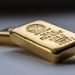 Gold Drops 0.2% to $2,415.61 Amid Strong Dollar