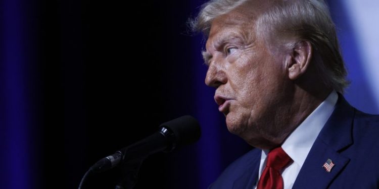 24 hours of Trump: QAnon tributes, crude attacks and hawking pieces of his suit